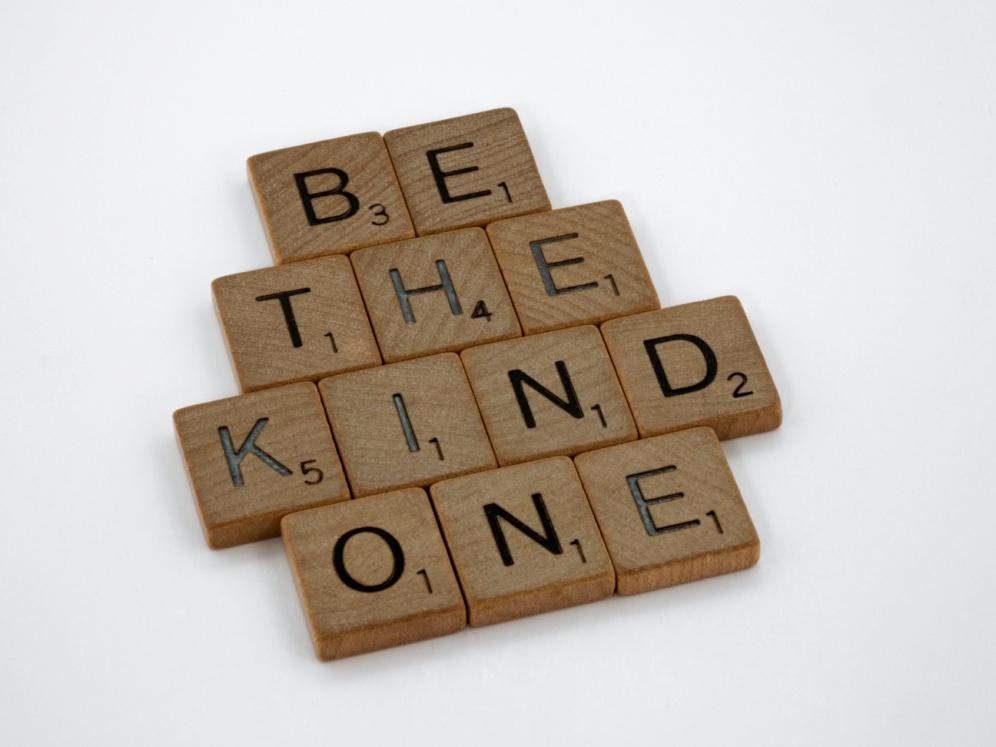 Wooden pieces with the phrase “Be the Kind one” written on them