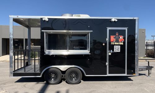 Black food trailer for Filipps Cafe with open serving window, fold-down ramp, and exterior branding reading "Est. 1951 – A Tradition Continues," parked in the JRS Custom Food Trucks & Trailers lot