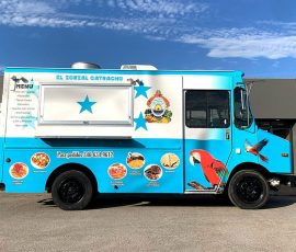 El Zorzal Catracho Honduran food truck with a wrap styled after the Honduran flag featuring blue and white colors, five stars, the national coat of arms, a scarlet macaw illustration, circular menu food photos, and a Spanish menu listing along the side