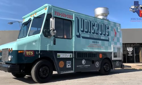 Passenger side of the completed Ludicrous food truck displaying the full branded wrap with large logo, tagline "The Food You Crave," rooftop exhaust vent, and sponsor decals