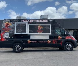 Naughty Slices Dallas pizza food truck van with a black and red wrap featuring the brand mascot, "Pizza by the Slice" header, service window, and "Hot Pizza. Cooler Vibes." tagline