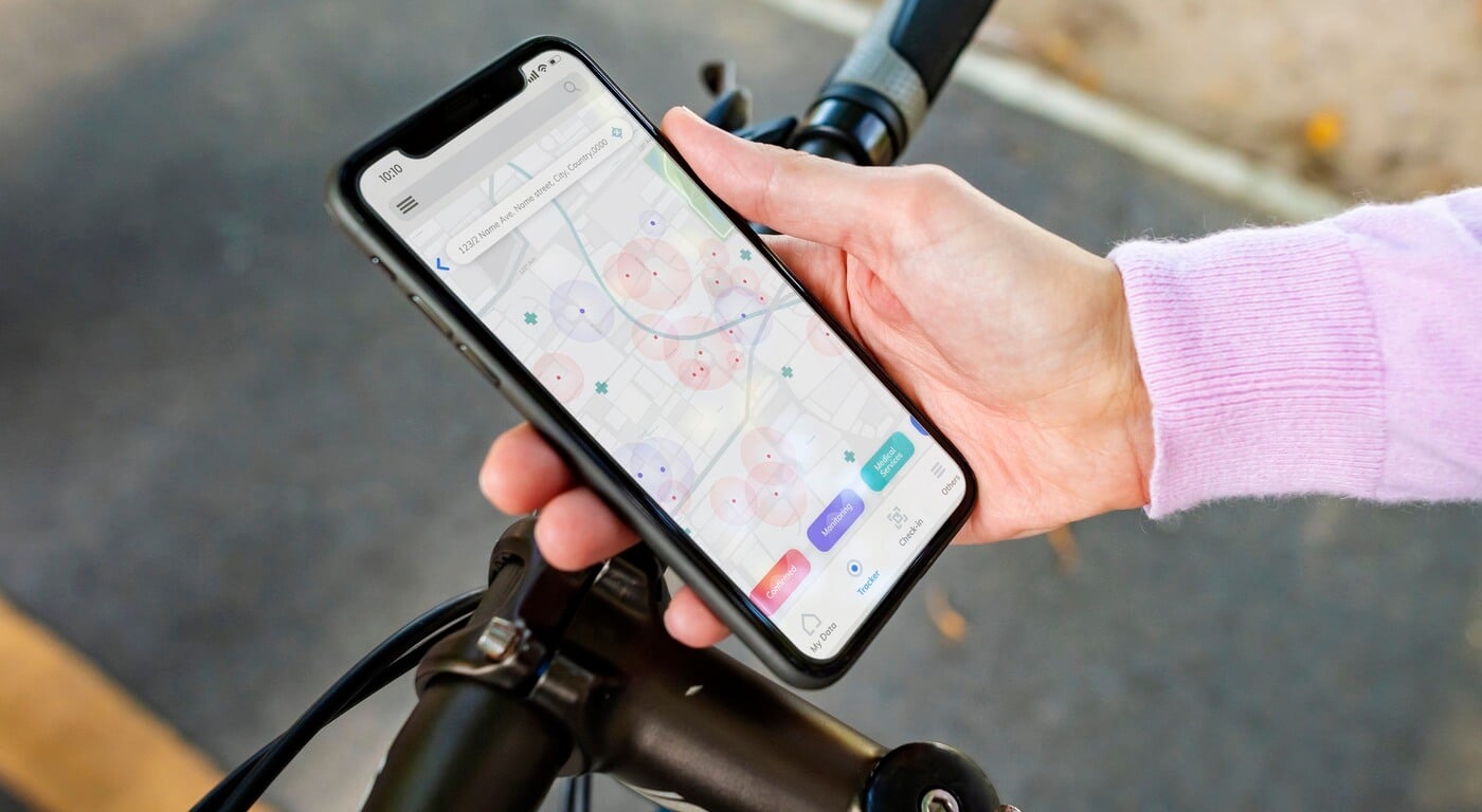 hand holding a phone with a gps app open