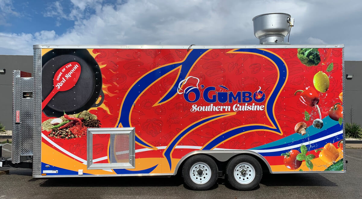 O'Gumbo Southern Cuisine food trailer with bold red full wrap graphics featuring food imagery and ventilation hood