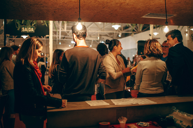 Group of professionals networking at an indoor industry event